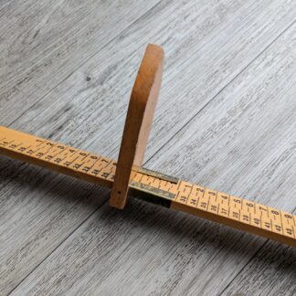 wooden measuring stick for measuring feet