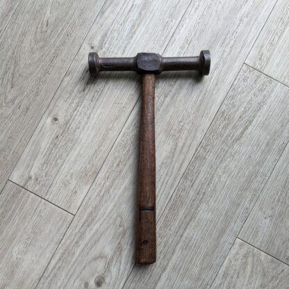 vintage hammer for nailing with wooden handle